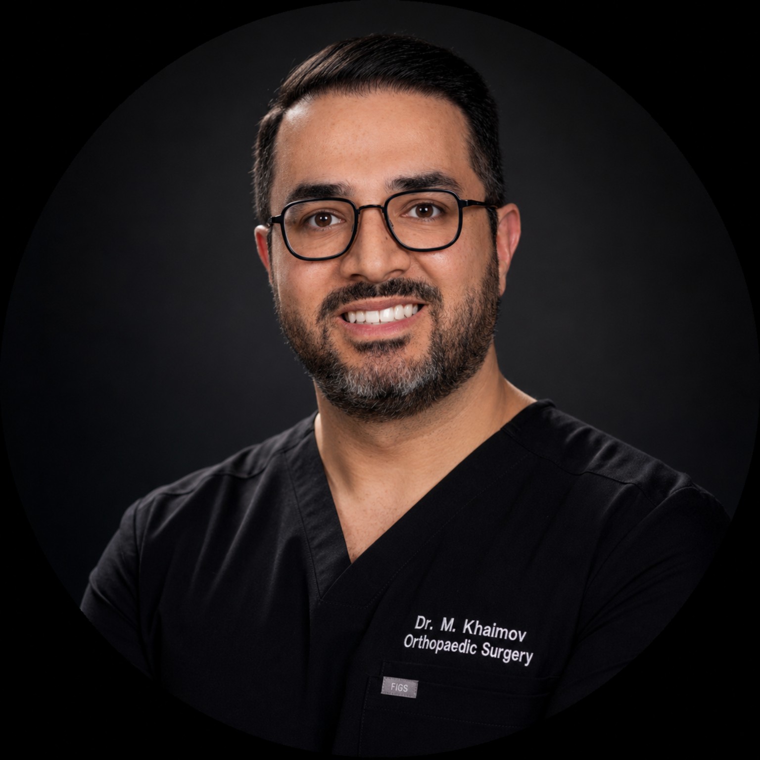 Dr. Mikhail Khaimov in black surgical scrubs